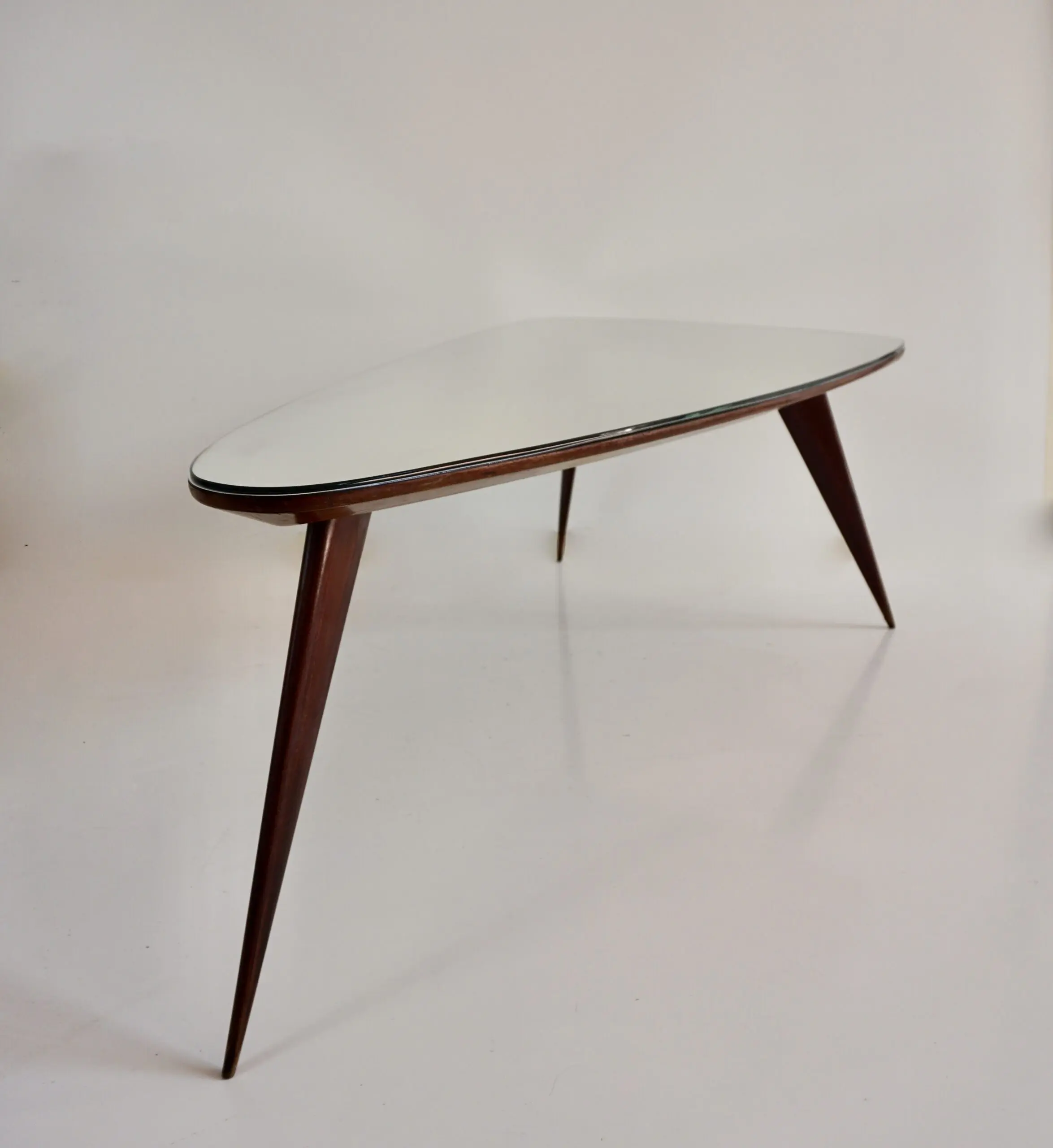 large Cesare Lacca walnut coffee table, three feet irregular shape, mirrored top — photo 5